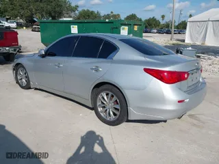 2014 Infiniti Q50 with VIN JN1BV7AP4EM677506, listed as a IAAI auction lot 40113207 with 142,446 mi miles. Bid and sale history available at carsss.com. Image 3.