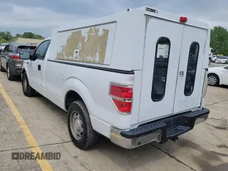 2014 Ford F-150 XL with VIN 1FTMF1CM5EKG22867, listed as a IAAI auction lot 42000275 with 200,657 mi miles. Bid and sale history available at carsss.com. Image 1.