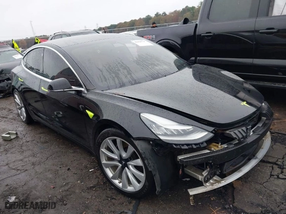 2019 Tesla Model 3 Mid Range with VIN 5YJ3E1EA1KF357522, listed as a IAAI auction lot 41025245 with 130,018 mi miles. Bid and sale history available at carsss.com. Image 1.