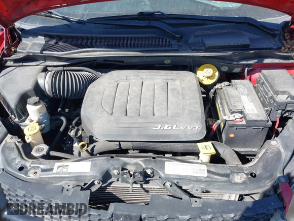 2014 Dodge Grand Caravan SXT with VIN 2C4RDGCG1ER331387, listed as a IAAI auction lot 41810447 with 118,797 mi miles and . Bid and sale history available at DreamBid. Image 10.