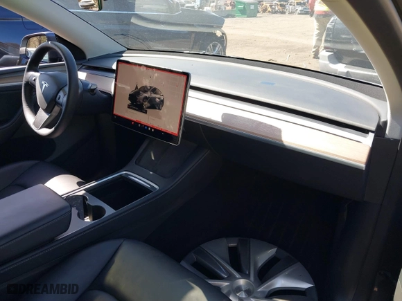 2023 Tesla Model Y Long Range with VIN 7SAYGDEEXPA175104, listed as a IAAI auction lot 41821928 with 52,791 mi miles. Bid and sale history available at carsss.com. Image 5.