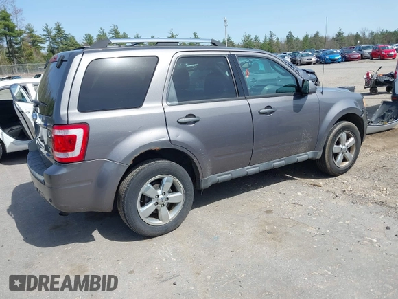 2011 Ford Escape Limited with VIN 1FMCU9EG6BKB01025, listed as a IAAI auction lot 42136708 with 210,349 mi miles. Bid and sale history available at carsss.com. Image 4.