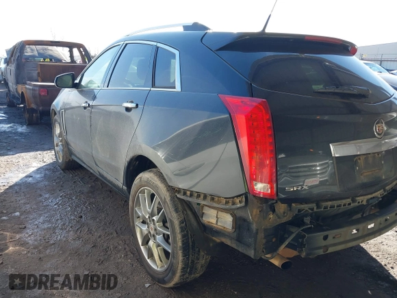 2014 Cadillac SRX Premium Collection z VIN 3GYFNDE34ES581728, wystawiony jako IAAI lot #41578226 z przebiegiem 121 118 mil mil oraz . Historia ofert i sprzedaży dostępna na DreamBid. Obrazek 3.