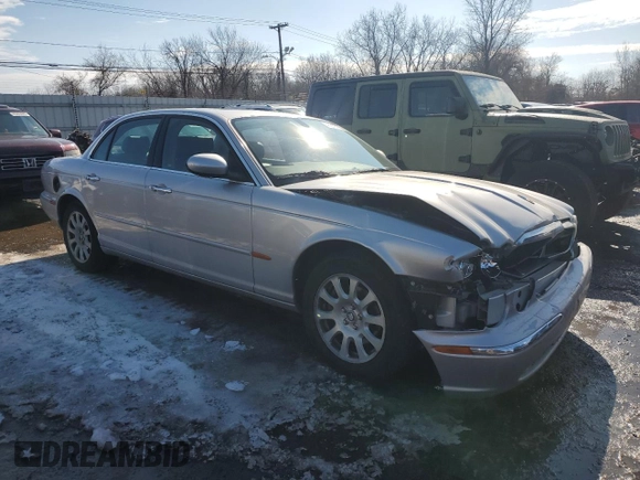 2004 Jaguar XJ with VIN SAJEA71C04SG04022, listed as a Copart auction lot 45875105 with 153,453 mi miles and Salvage Title. Bid and sale history available at carsss.com. Image 4.