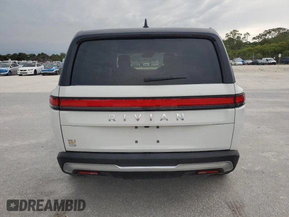 2023 Rivian R1S Adventure z VIN 7PDSGABA3PN024458, wystawiony jako Copart lot #74087714 z przebiegiem 3 505 mil mil oraz Nie do naprawy • Non repairable. Historia ofert i sprzedaży dostępna na DreamBid. Obrazek 6.