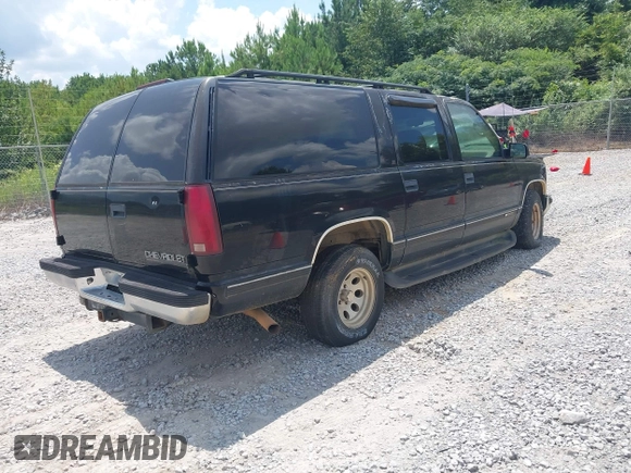 1996 Chevrolet Suburban with VIN 3GNEC16R3TG120004, listed as a IAAI auction lot 42752410 with 291,491 mi miles and . Bid and sale history available at DreamBid. Image 4.