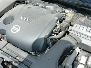 2014 Nissan Maxima SV z VIN 1N4AA5APXEC465391, wystawiony jako IAAI lot #42560904 z przebiegiem 146 887 mil mil oraz . Historia ofert i sprzedaży dostępna na DreamBid. Obrazek 12.