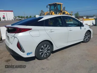 2021 Toyota Prius LE with VIN JTDKAMFP2M3177459, listed as a IAAI auction lot 42093828 with 65,501 mi miles and . Bid and sale history available at DreamBid. Image 4.