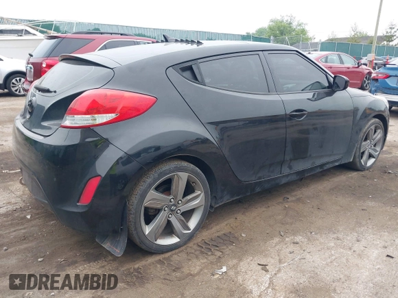 2013 Hyundai Veloster w/Black Int with VIN KMHTC6AD7DU170049, listed as a IAAI auction lot 42441737 with 101,924 mi miles and . Bid and sale history available at DreamBid. Image 4.