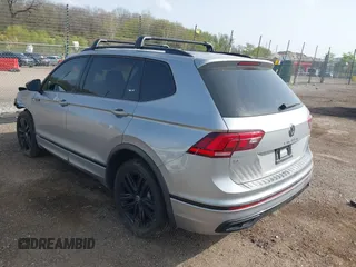 2022 Volkswagen Tiguan SE R-Line Black with VIN 3VV8B7AX7NM030703, listed as a IAAI auction lot 42135974 with 57,116 mi miles and . Bid and sale history available at DreamBid. Image 3.