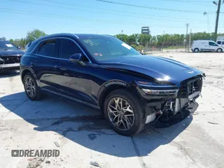 2022 Genesis GV70 2.5T with VIN KMUMADTB9NU046877, listed as a IAAI auction lot 41821199 with 28,546 mi miles and . Bid and sale history available at DreamBid. Image 1.