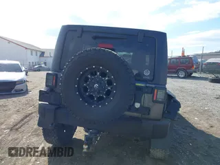 2014 Jeep Wrangler Unlimited Sport with VIN 1C4HJWDG1EL251271, listed as a IAAI auction lot 41647210 with 100,168 mi miles. Bid and sale history available at carsss.com. Image 17.