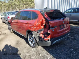 2015 BMW X1 xDrive28i with VIN WBAVL1C58FVY24900, listed as a IAAI auction lot 41772097 with 128,001 mi miles. Bid and sale history available at carsss.com. Image 3.