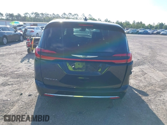2023 Chrysler Pacifica Touring L with VIN 2C4RC1BG1PR606566, listed as a IAAI auction lot 42615498 with 42,980 mi miles and . Bid and sale history available at DreamBid. Image 16.