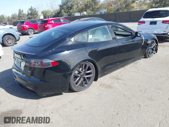 2022 Tesla Model S Plaid with VIN 5YJSA1E62NF460634, listed as a IAAI auction lot 41372644 with 16,050 mi miles and . Bid and sale history available at DreamBid. Image 4.