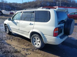 2003 Suzuki XL7 Touring z VIN JS3TX92V734100178, wystawiony jako IAAI lot #41386492 z przebiegiem 91 912 mil mil oraz . Historia ofert i sprzedaży dostępna na DreamBid. Obrazek 3.