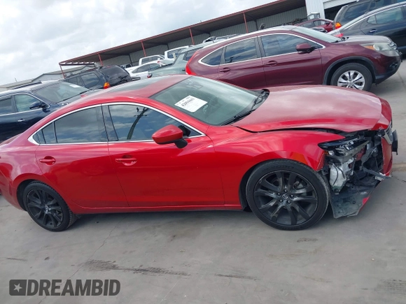 2016 Mazda 6 i Grand Touring z VIN JM1GJ1W58G1486694, wystawiony jako IAAI lot #42094443 z przebiegiem 77 803 mil mil oraz . Historia ofert i sprzedaży dostępna na DreamBid. Obrazek 13.