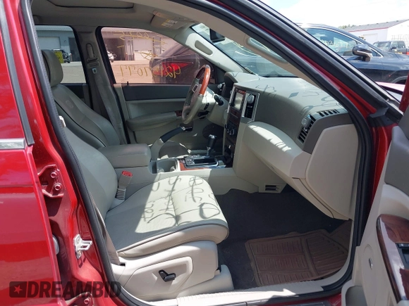 2009 Jeep Grand Cherokee with VIN 1J8HR68T79C539925, listed as a IAAI auction lot 42157077 with 140,443 mi miles and . Bid and sale history available at DreamBid. Image 5.