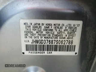 2007 Honda Fit Sport z VIN JHMGD37687S062788, wystawiony jako Copart lot #58374245 z przebiegiem Nie podano mil oraz Czysty tytuł • Clean title. Historia ofert i sprzedaży dostępna na DreamBid. Obrazek 13.