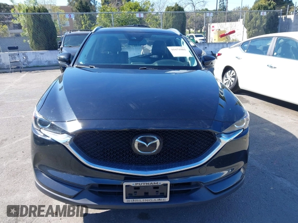2021 Mazda CX-5 Touring with VIN JM3KFACM2M0339349, listed as a IAAI auction lot 41651005 with 53,792 mi miles. Bid and sale history available at carsss.com. Image 12.