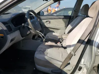 2009 Kia Spectra EX with VIN KNAFE221X95631249, listed as a Copart auction lot 75119304 with 193,338 mi miles and Salvage Title. Bid and sale history available at carsss.com. Image 7.