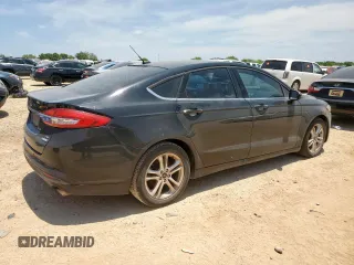 2018 Ford Fusion SE z VIN 3FA6P0HD5JR252718, wystawiony jako Copart lot #60549335 z przebiegiem 120 807 mil mil oraz Czysty tytuł • Clean title. Historia ofert i sprzedaży dostępna na DreamBid. Obrazek 3.