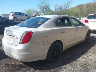 2010 Lincoln MKS w/EcoBoost with VIN 1LNHL9FT3AG611242, listed as a IAAI auction lot 42142027 with 103,758 mi miles. Bid and sale history available at carsss.com. Image 4.