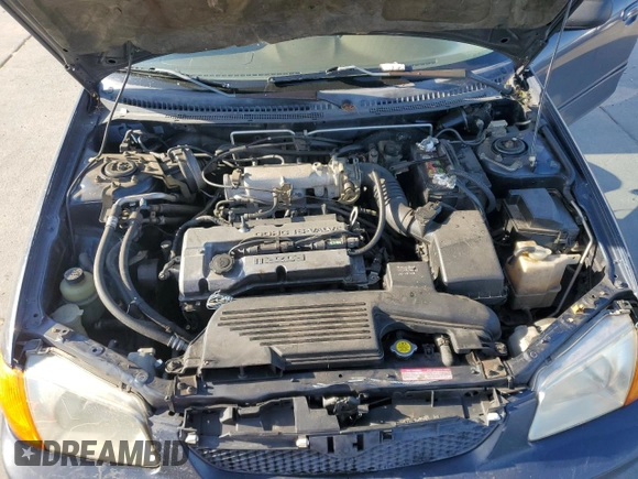 1999 Mazda Protege DX z VIN JM1BJ2227X0106522, wystawiony jako Copart lot #52423565 z przebiegiem 206 260 mil mil oraz Szkoda całkowita • Salvage title. Historia ofert i sprzedaży dostępna na DreamBid. Obrazek 11.