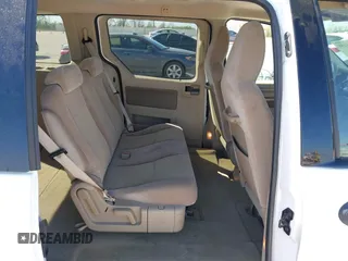2006 Ford Freestar SE z VIN 2FMZA51686BA57540, wystawiony jako IAAI lot #41883258 z przebiegiem 38 590 mil mil oraz . Historia ofert i sprzedaży dostępna na DreamBid. Obrazek 8.