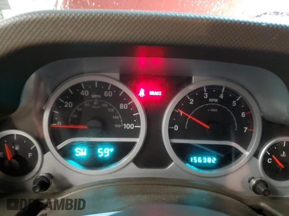 2007 Jeep Wrangler Unlimited Sahara with VIN 1J4GA59197L104784, listed as a Copart auction lot 56700205 with 156,382 mi miles and Salvage title. Bid and sale history available at DreamBid. Image 9.