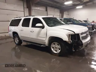 2011 Chevrolet Suburban LT with VIN 1GNSKJE34BR239651, listed as a IAAI auction lot 39211605 with 215,137 mi miles. Bid and sale history available at carsss.com. Image 1.