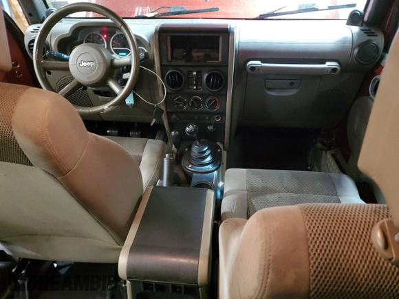 2007 Jeep Wrangler Unlimited Sahara with VIN 1J4GA59197L104784, listed as a Copart auction lot 56700205 with 156,382 mi miles and Salvage title. Bid and sale history available at DreamBid. Image 8.