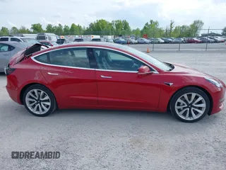 2018 Tesla Model 3 Long Range Battery with VIN 5YJ3E1EA8JF031683, listed as a IAAI auction lot 39275313 with 136,939 mi miles and . Bid and sale history available at DreamBid. Image 13.