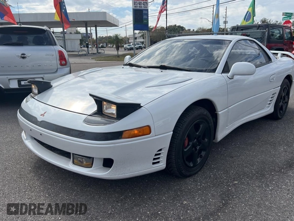 1992 Mitsubishi 3000GT z VIN JA3XE74CXNY058167, wystawiony jako Copart lot #84192254 z przebiegiem 69 411 mil mil oraz Czysty tytuł • Clean title. Historia ofert i sprzedaży dostępna na DreamBid. Obrazek 2.