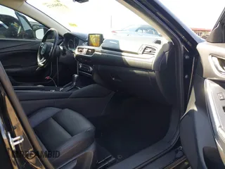 2017 Mazda Mazda6 Touring with VIN JM1GL1V55H1155696, listed as a IAAI auction lot 42003172 with 95,300 mi miles. Bid and sale history available at carsss.com. Image 5.