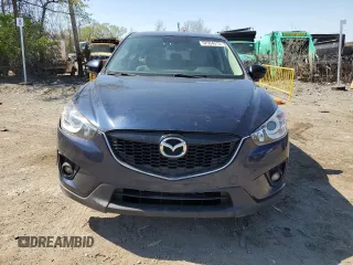 2014 Mazda CX-5 Touring with VIN JM3KE4CY4E0407868, listed as a Copart auction lot 52564315 with 137,989 mi miles and Salvage Title. Bid and sale history available at carsss.com. Image 5.