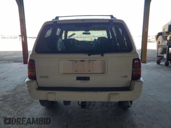 1996 Jeep Grand Cherokee with VIN 1J4EZ78Y9TC104398, listed as a Copart auction lot 69706254 with Not provided miles and Salvage title. Bid and sale history available at DreamBid. Image 6.
