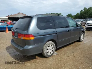2003 Honda Odyssey EX-L with VIN 5FNRL18933B116127, listed as a Copart auction lot 56013645 with 157,118 mi miles and Salvage Title. Bid and sale history available at DreamBid. Image 3.