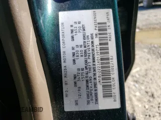1999 Mazda Protege DX with VIN JM1BJ2223X0139775, listed as a Copart auction lot 54338455 with 63,198 mi miles and Salvage Title. Bid and sale history available at DreamBid. Image 12.