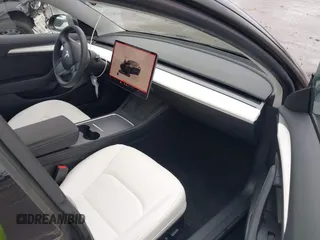 2023 Tesla Model 3 with VIN 5YJ3E1EA0PF587656, listed as a IAAI auction lot 41489586 with 12,844 mi miles and . Bid and sale history available at DreamBid. Image 5.