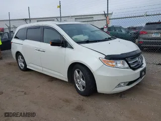 2013 Honda Odyssey Touring with VIN 5FNRL5H96DB089336, listed as a IAAI auction lot 41527990 with 128,770 mi miles. Bid and sale history available at carsss.com. Image 1.