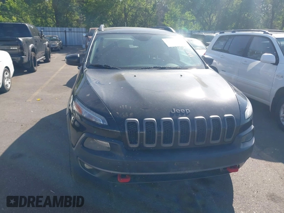 2015 Jeep Cherokee Trailhawk with VIN 1C4PJMBS4FW556822, listed as a IAAI auction lot 42412874 with 129,865 mi miles and . Bid and sale history available at DreamBid. Image 12.