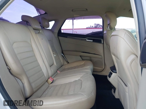 2013 Ford Fusion SE Hybrid z VIN 3FA6P0LU1DR310075, wystawiony jako IAAI lot #42085556 z przebiegiem Nie podano mil oraz . Historia ofert i sprzedaży dostępna na DreamBid. Obrazek 8.