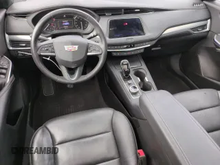 2023 Cadillac XT4 FWD Premium Luxury z VIN 1GYFZCR49PF104995, wystawiony jako Copart lot #53312695 z przebiegiem 28 647 mil mil oraz Szkody całkowita. Historia ofert i sprzedaży dostępna na DreamBid. Obrazek 8.