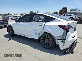 2022 Tesla Model Y Performance z VIN 7SAYGDEF6NF397082, wystawiony jako Copart lot #55823435 z przebiegiem Nie podano mil oraz Szkoda całkowita • Salvage title. Historia ofert i sprzedaży dostępna na DreamBid. Obrazek 2.