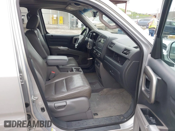 2012 Honda Ridgeline RTL with VIN 5FPYK1F58CB454385, listed as a IAAI auction lot 42212805 with 207,874 mi miles and . Bid and sale history available at DreamBid. Image 5.
