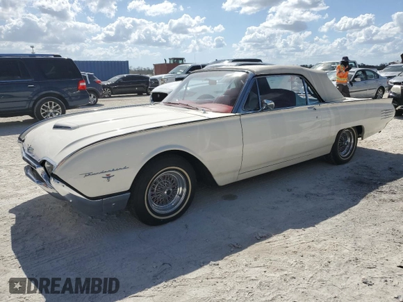 1961 Ford Thunderbird with VIN 1Y73Z112797, listed as a Copart auction lot 77574894 with 22,246 mi miles and Salvage Title. Bid and sale history available at DreamBid. Image 1.