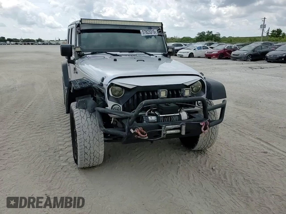 2012 Jeep Wrangler Unlimited Sport z VIN 1C4BJWDG8CL220960, wystawiony jako Copart lot #57823315 z przebiegiem 177 541 mil mil oraz Szkoda całkowita • Salvage title. Historia ofert i sprzedaży dostępna na DreamBid. Obrazek 15.