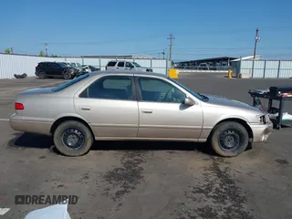 2000 Toyota Camry CE z VIN JT2BG22K2Y0440255, wystawiony jako IAAI lot #42088080 z przebiegiem 353 102 mil mil oraz . Historia ofert i sprzedaży dostępna na DreamBid. Obrazek 13.