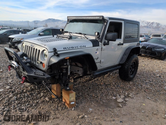 2007 Jeep Wrangler Rubicon z VIN 1J8GA64157L125319, wystawiony jako Copart lot #82929184 z przebiegiem 82 019 mil mil oraz Szkoda całkowita • Salvage title. Historia ofert i sprzedaży dostępna na DreamBid. Obrazek 1.